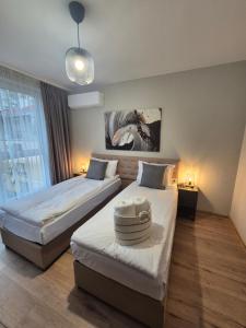 Postel nebo postele na pokoji v ubytování LUNY CITY Center