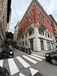 a group of motorcycles parked in front of a building at Casa Monticello 1 in Trieste