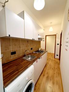 a kitchen with a sink and a counter top at Casa Monticello 1 in Trieste