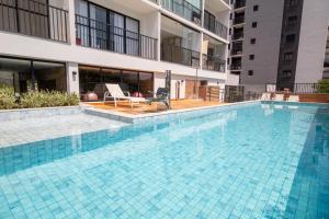 a swimming pool in the middle of a building at Maison Perdizes - Allianz Parque Supreme in Sao Paulo