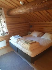 Ένα ή περισσότερα κρεβάτια σε δωμάτιο στο Timmervillan Funäsdalen