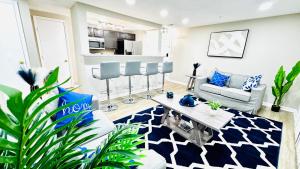 a living room with a couch and a table at Lavish Escape in Charlotte +25 photos
