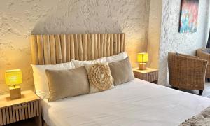 Кровать или кровати в номере Koho SXM - ex Hevea Hotel