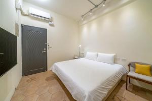 Ένα ή περισσότερα κρεβάτια σε δωμάτιο στο Yunhua B&B