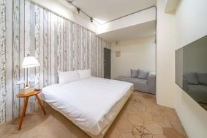 Ένα ή περισσότερα κρεβάτια σε δωμάτιο στο Yunhua B&B +31 φωτογραφίες