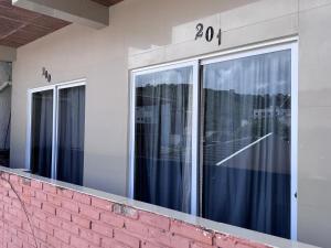 a building with windows with the number on it at Pousada Solare in Maragogi