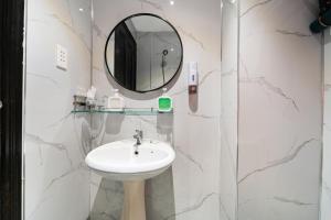 a bathroom with a sink and a mirror at Nicecy Daily - Yersin Street in Ho Chi Minh City +29 photos
