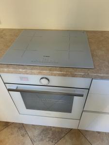 a kitchen counter with a stove top oven at Niedras place in Degole