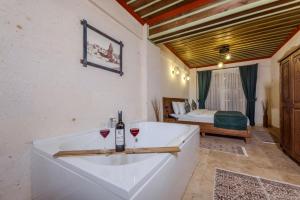 Кровать или кровати в номере Mai Cappadocia Hotel