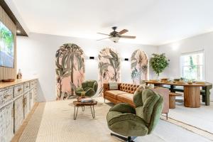 a living room with a couch and chairs at Pet-Friendly Tropical Oasis with Fire Pit & Garden in Charleston