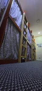 a row of bunk beds in a room at Adventure Rehlet Moghamer hostel in Dubai