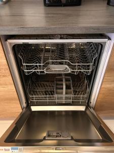an oven with a dish rack inside of it at Bubali Modern Suites Aruba in Palm-Eagle Beach