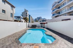 a swimming pool on the roof of a building at Mountain Tide in Cape Town