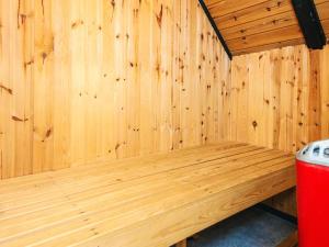 a wooden sauna with a bench in a room at 4 star holiday home in Rømø in Kongsmark