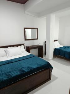Ένα ή περισσότερα κρεβάτια σε δωμάτιο στο Magnola Hotels