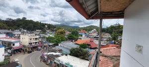 a view of a town from a building at Dolphin Residency in Thekkady
