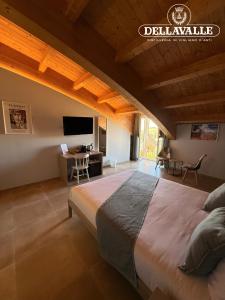 a bedroom with a large bed in a room at Dellavalle Guest House in Vigliano d'Asti +11 photos