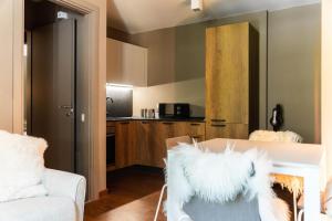 a living room with a couch and a table at Maison Poluc - Suite Alpine in Champoluc