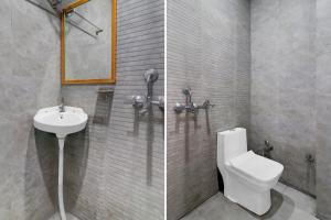 a bathroom with a toilet and a sink at Hotel O Shauryam in Kankhal