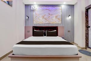 Ένα ή περισσότερα κρεβάτια σε δωμάτιο στο Hotel O Shauryam
