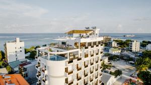 an aerial view of a building overlooking the ocean at Arrival Beach and Spa in Gulhi
