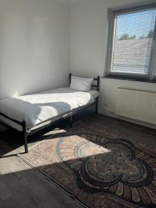 Ένα ή περισσότερα κρεβάτια σε δωμάτιο στο Apartment 20qm Prisdorf +29 φωτογραφίες