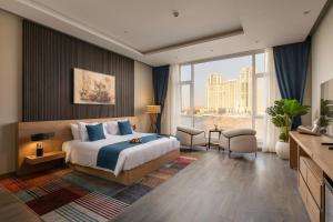 a hotel room with a bed and a large window at Riverside Hotel in Cairo