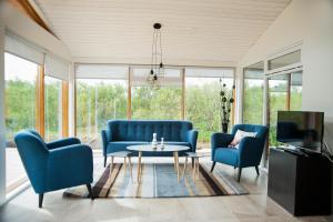 Televisyen dan/atau pusat hiburan di Harpa Holiday Home - Birta Rentals