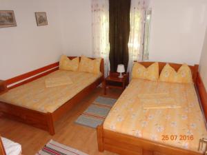 Postel nebo postele na pokoji v ubytování Casa Munteanu