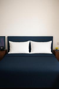 Ένα ή περισσότερα κρεβάτια σε δωμάτιο στο GioiApartment - B&B Scalo Romana Villaggio Olimpico