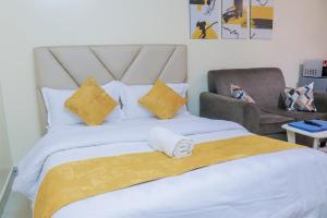 Ένα ή περισσότερα κρεβάτια σε δωμάτιο στο Cozy Studio at Elgon Hill Homes