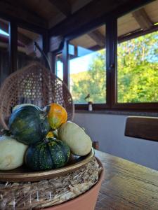 a plate of vegetables on a table with a window at Kuća za odmor La Vi in Mrkopalj