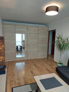 a living room with a couch and a table at Apartament 59 , ranczoturystyka Bielawa Sudety in Bielawa