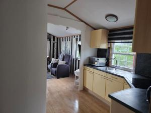 a kitchen and living room in a house at Peace and beautiful views in Rohel