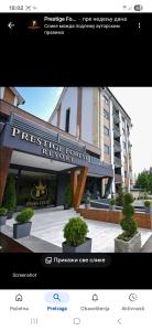 a page of a hotel with a picture of a building at Apartman Zlatibor in Zlatibor