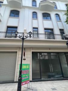 a building with a sign in front of it at Kinh Đô 5 - 20 - 21 in Ðình Loan