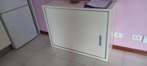 a large white door in a room with a tile floor at Rosaviola in Vimodrone