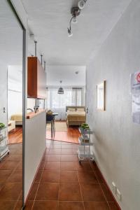 a room with a kitchen and a living room at Lempi Lodge Hosted by Hygge Host in Rovaniemi