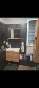 a bathroom with a sink and a mirror at Nina apartman in Komárno