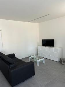 TV a/nebo společenská místnost v ubytování B&B Bozzini's Nest