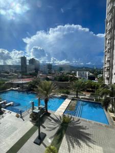 a view of a swimming pool from a building at Evan's pad, Horizons 101 T1 in Cebu City