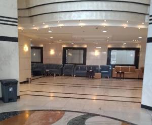 a lobby with couches and chairs in a building at Jawaher Al Hashmiya 6 Hotel Makkah by Moro in Makkah