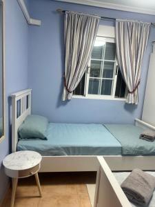 a bedroom with two bunk beds and a window at Bungalow Carabassi Mediterraneo 3 Pool and roof terrace in Puerto Marino +25 photos