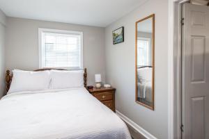 Ένα ή περισσότερα κρεβάτια σε δωμάτιο στο The Cozy Cottage