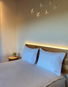 Ένα ή περισσότερα κρεβάτια σε δωμάτιο στο Sweet Quintanilha