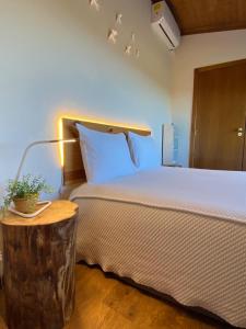 Postel nebo postele na pokoji v ubytování Sweet Quintanilha