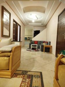 a living room with a couch and a table at A nice appartement a louer temara in Temara