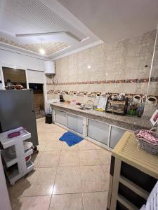 a kitchen with a sink and a counter at A nice appartement a louer temara in Temara