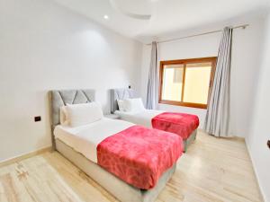 Ένα ή περισσότερα κρεβάτια σε δωμάτιο στο les Belles Sejours