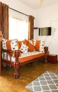 TV a/nebo společenská místnost v ubytování Beverly Africa Suites Malindi + 25 fotografií